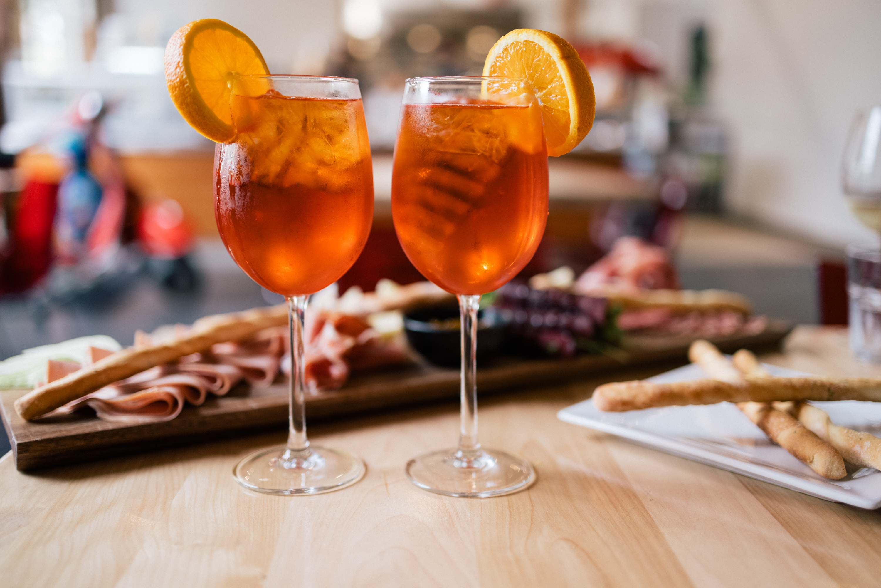 Two Aperol Spritzes with orange garnish